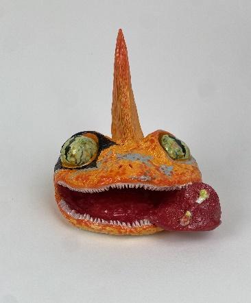 A toy animal with a mouth and tongue